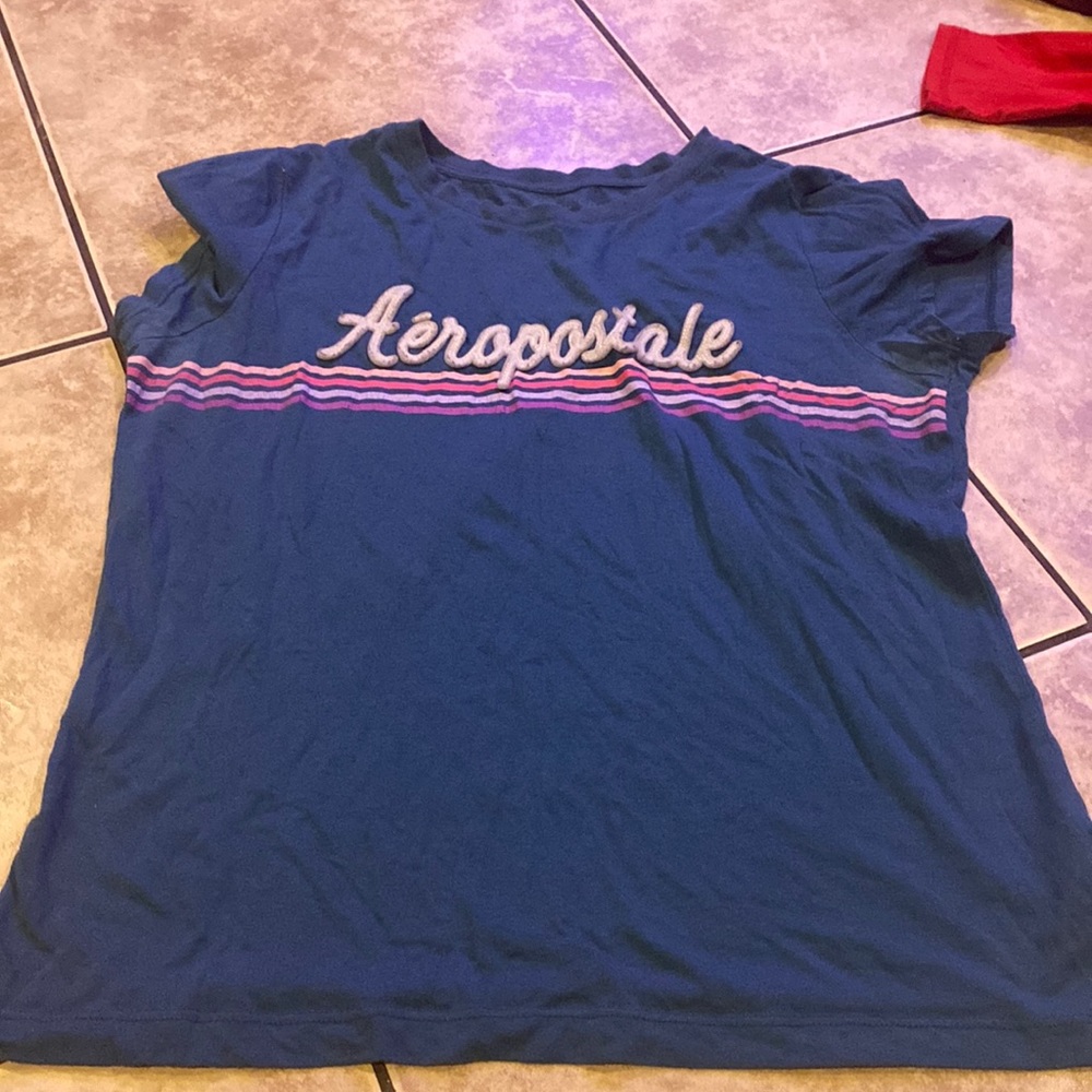 Teal & rainbow Aeropostale shirt.